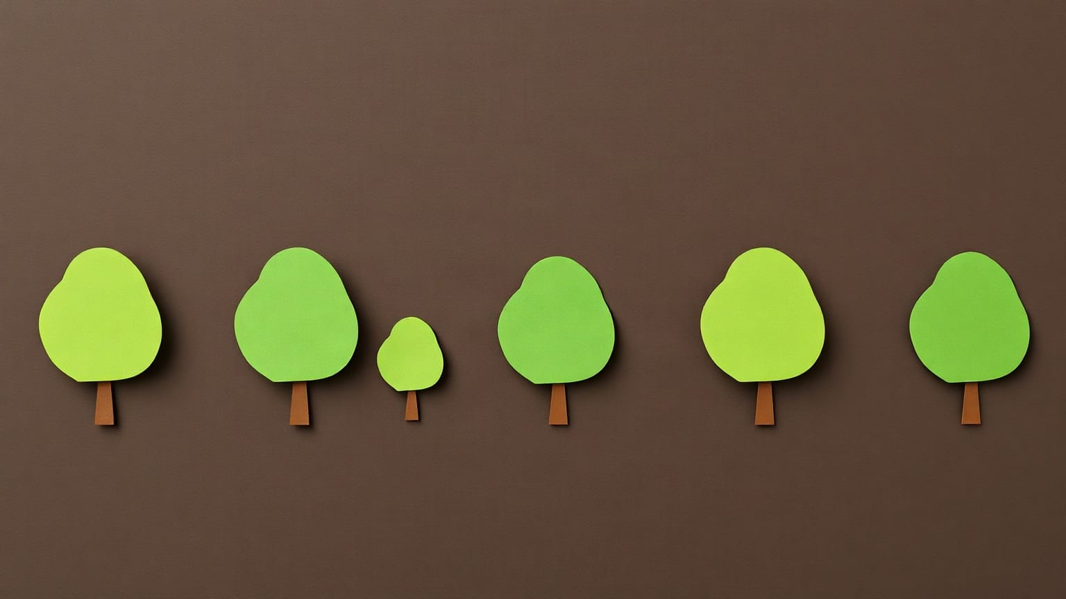 Six flat green paper trees on short orange trunks standing in a row across a dark brown ground, one of them much smaller than the rest