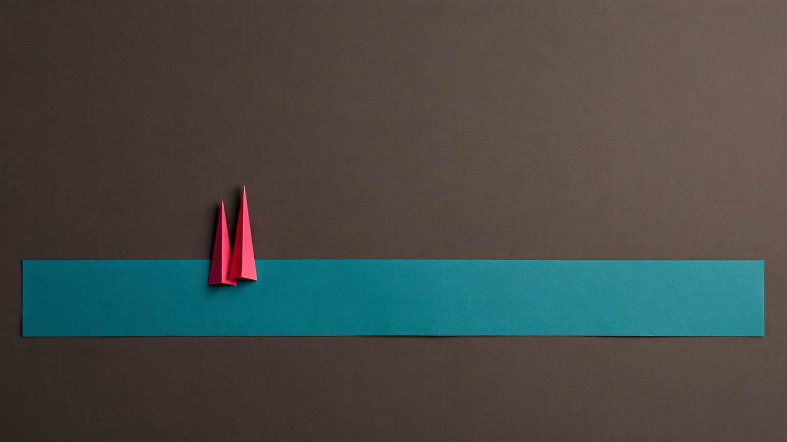 A long flat teal paper band running the width of a dark brown ground, with two narrow magenta paper spires standing on it near the left